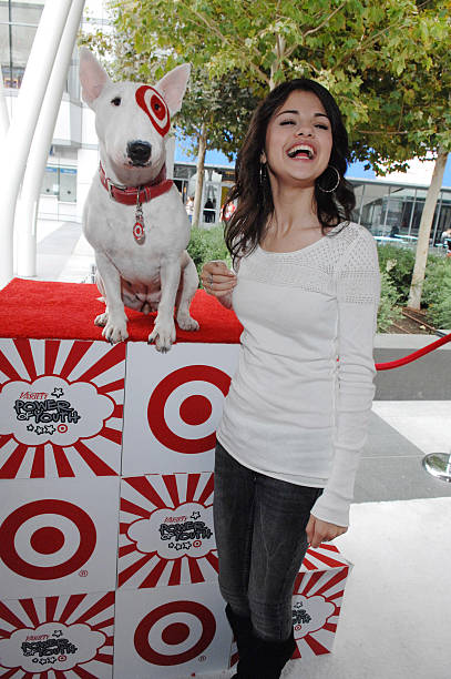 Actress Selena Gomez poses for a photo with BullsEye at 'Target Presents Variety's Power of Youth' event held at NOKIA Theatre L.A. LIVE on October...