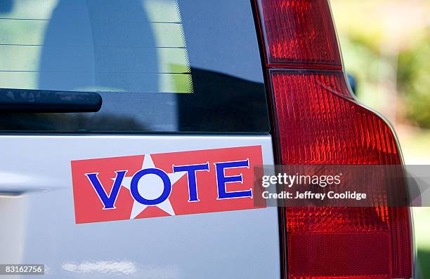 vote bumper sticker on car - bumper sticker stock pictures, royalty-free photos & images