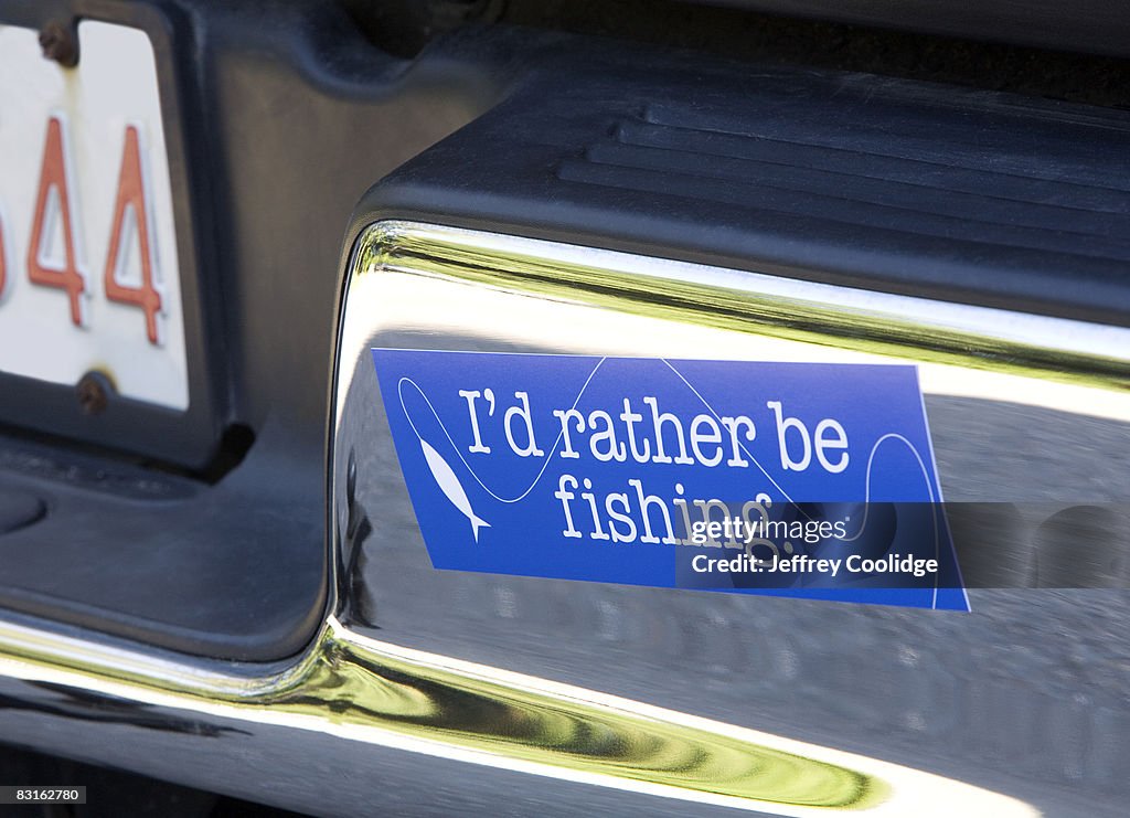 Fishing bumper sticker on car