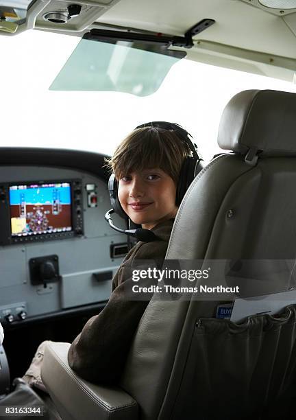 young boy in the cockpit of a small seaplane. - cockpit stock pictures, royalty-free photos & images