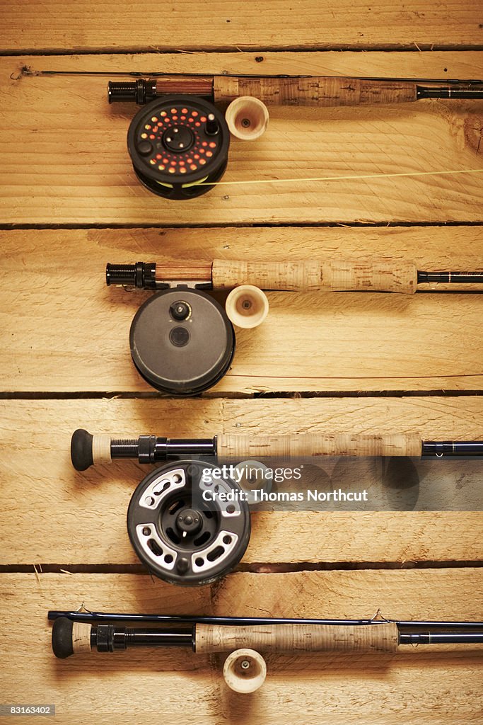 Fly fishing reels hanging on wall