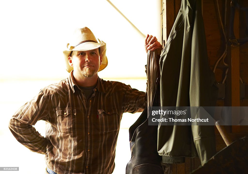 Man standing in barn doorway