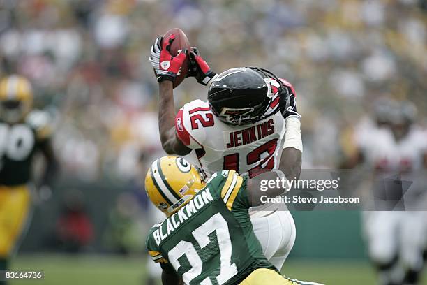 Atlanta Falcons Michael Jenkins in action, making catch vs Green Bay Packers Will Blackmon attempts tackle during 4th quarter. Blackmon received...