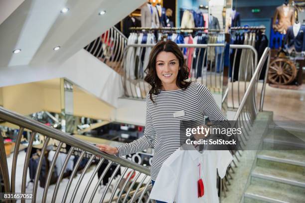 retail shop assistant at work - menswear shopping stock pictures, royalty-free photos & images