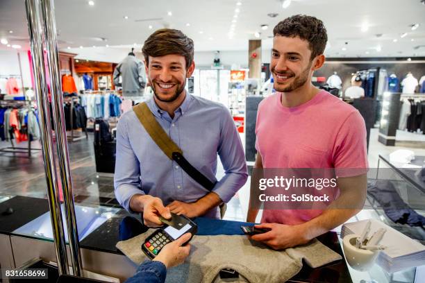 contactless payment is quick and easy - mens clothing stock pictures, royalty-free photos & images