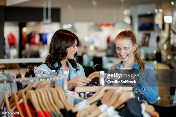 helping him pick out a new shirt - designer fashion stock pictures, royalty-free photos & images