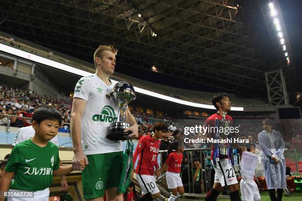 Grolli of Chapecoense holding Copa Sudamericana leads the team entering the pitch prior to the Suruga Bank Championship match between Urawa Red...