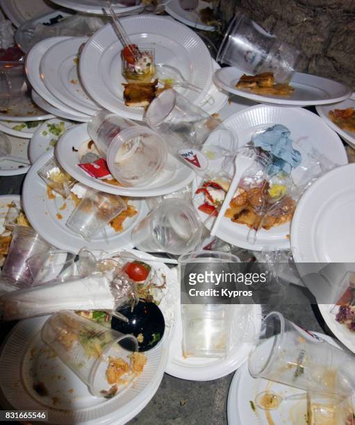 europe, greece, rhodes island, view of piles of discarded plastic throw away plates after street party - cleaning up after party stock-fotos und bilder