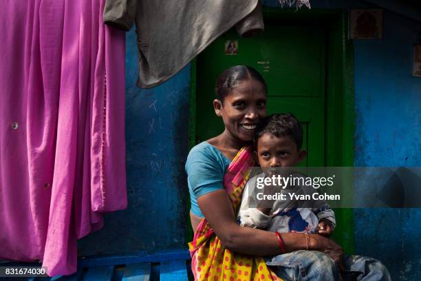 Mother sits with her child in the Fakir Bagan area of Kolkata, in the area where the charity Calcutta Kids works. Founded in 2004, Calcutta Kids is a...