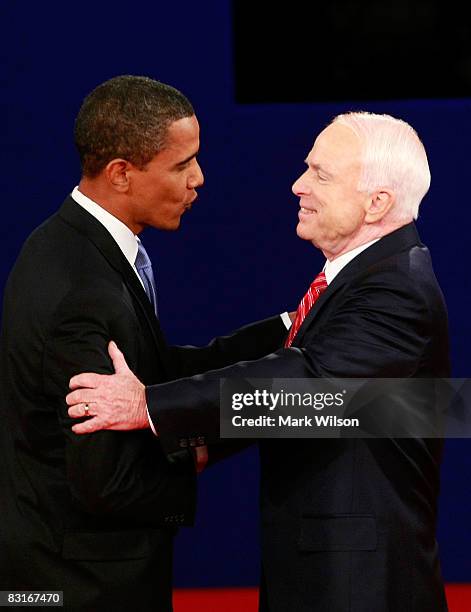 Republican presidential candidate Sen. John McCain greets Democratic presidential candidate Sen. Barack Obama during the Town Hall Presidential...