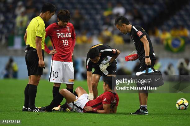 Ryota Moriwaki of Urawa Red Diamonds looks injured during the Suruga Bank Championship match between Urawa Red Diamonds and Chapecoense at Saitama...