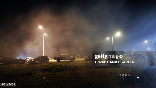 View of cars and trucks parked in the side of the route 191, near San Pedro, in the province of Buenos Aires on October 7 during a vigil in the fifth...