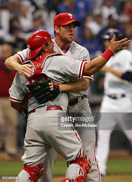 Brad Lidge#54 and Carlos Ruiz of the Philadelphia Phillies celebrate after the final out against the Milwaukee Brewers in game four of the NLDS...