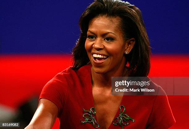 Michelle Obama, wife of Democratic presidential candidate Sen. Barack Obama , shakes hands after during the Town Hall Presidential Debate between...