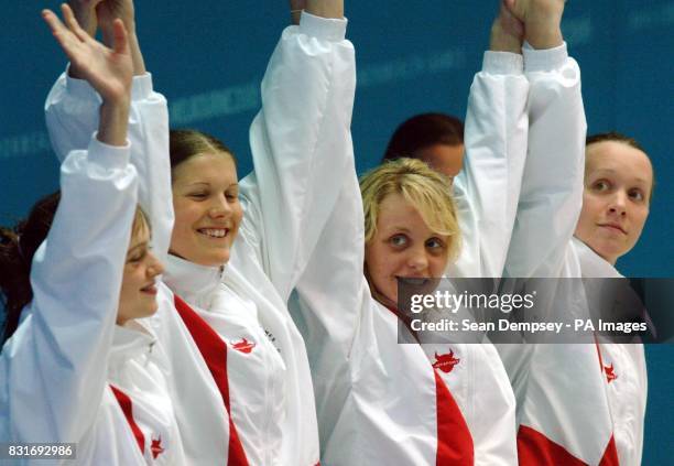 Melbourne Sports and Aquatic centre Swimming finals the womans 4x100m medley relay left to right Englands Terri Dunning Kate Haywood Francesca...