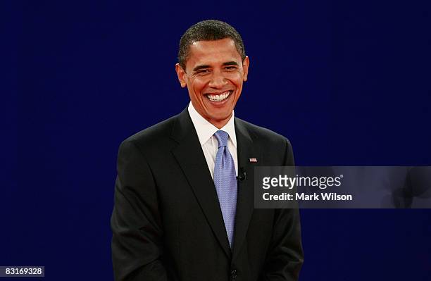 Democratic presidential candidate Sen. Barack Obama smiles on stage after the Town Hall Presidential Debate with Republican presidential candidate...