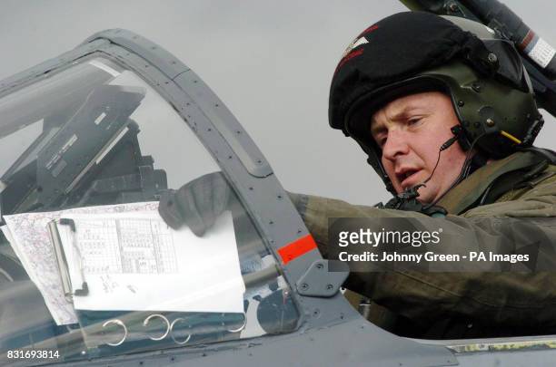 Wing Commander Dick MacCormack prepares for take-off in a SEPECAT Jaguar GR3 aircraft at RAF Coltishall in Norfolk, Saturday April 1, 2006. The...