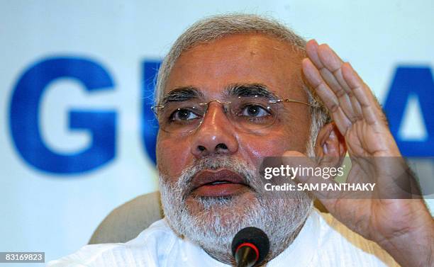 Chief minister of the western Indian state of Gujarat Narendra Modi gestures as he addresses a press conference in Gandhinagar on October 7, 2008....