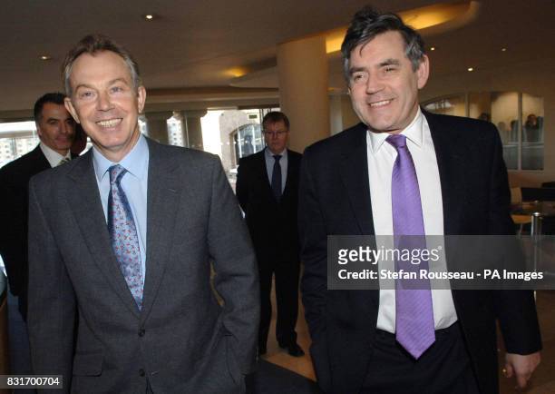 Britain's Prime Minister Tony Blair and Chancellor Gordon Brown arrive at the Labour Party's forthcoming local election headquarters in central...