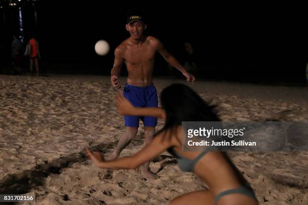Local residents play spike ball on Tumon Beach on August 15, 2017 in Tamuning, Guam. The American territory of Guam remains on high alert as a...