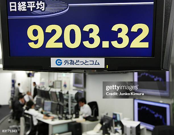 The Nikkei Stock Average is displayed on an electoric board at Gaitame.com, a foreign exchange trading company, on October 8, 2008 in Tokyo, Japan....