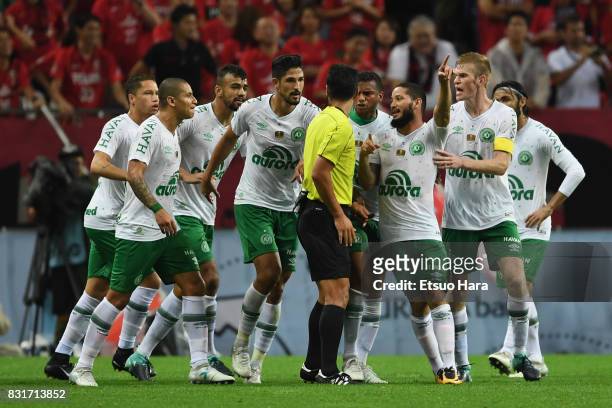 Chapecoense players protest to referee Kim Jong-hyeok against the penalty decision during the Suruga Bank Championship match between Urawa Red...