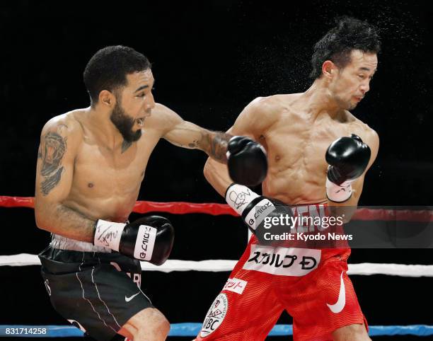 Mexican boxer Luis Nery throws a punch at Shinsuke Yamanaka of Japan in the second round of their WBC bantamweight title match at Shimadzu Arena...