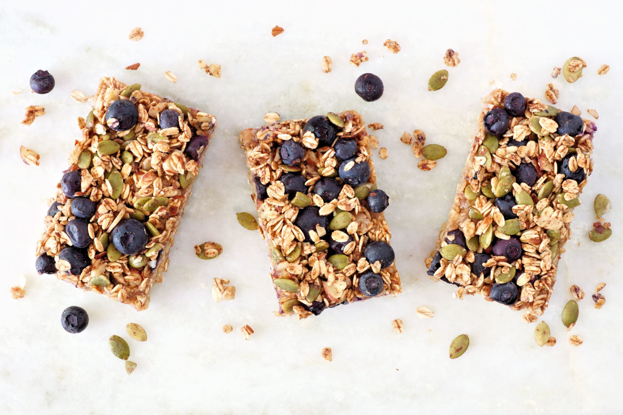 Superfood breakfast bars, above view on marble background Superfood breakfast bars, above view on marble background