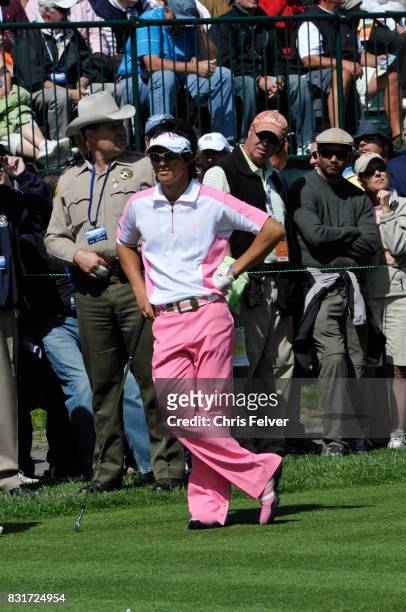 Japanese golfer Ryo Ishikawa leans on his club as he stands on the green during the 110th US Open golf championship, Pebble Beach, California, June...