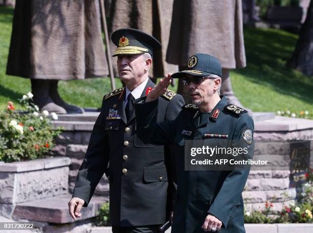 General Staff of the Armed Forces of Iran, Mohammad Bagheri salutes the honor guards as he is welcomed by Chief of the General Staff of the Turkish...