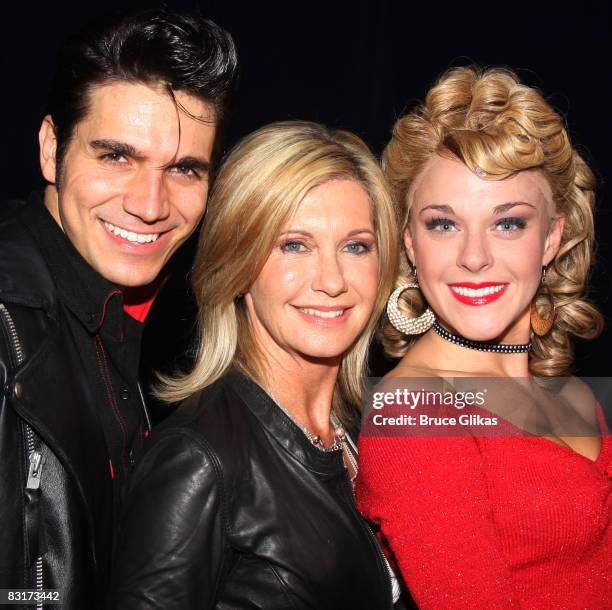 Derek Keeling , Olivia Newton-John and Ashley Spencer pose backstage at "Grease" to promote Breast Cancer Awareness Month at the Brooks Atkinson...