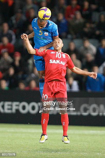 Cristiano of United has Luiz Nascimento of Bunyodkor jump over him to head the ball during the AFC Champions League semi-final first leg match...