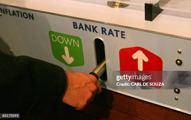 An interactive feature, designed for eductaional purposes, which challenges the user to control inflation by lowering or raising a lever, is pictured...