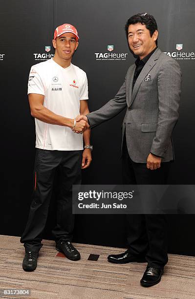 Formula 1 racing driver Lewis Hamilton and Industrial designer Ken Okuyama attend Tag Heuer "From F1 to GT Cars" Reception at Conrad Tokyo on October...