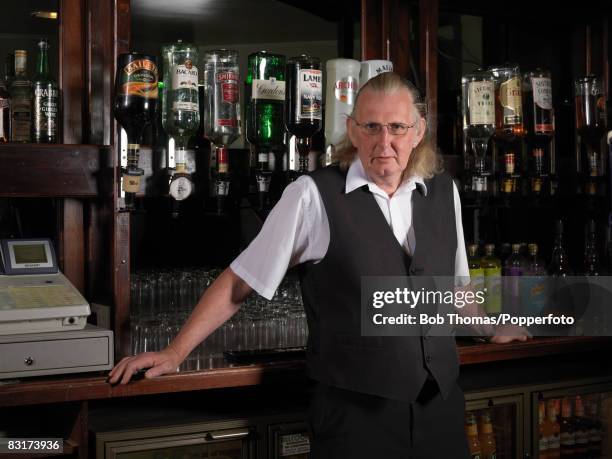 Pub landlord standing in his bar, Blackpool, England, 29th August 2007. .