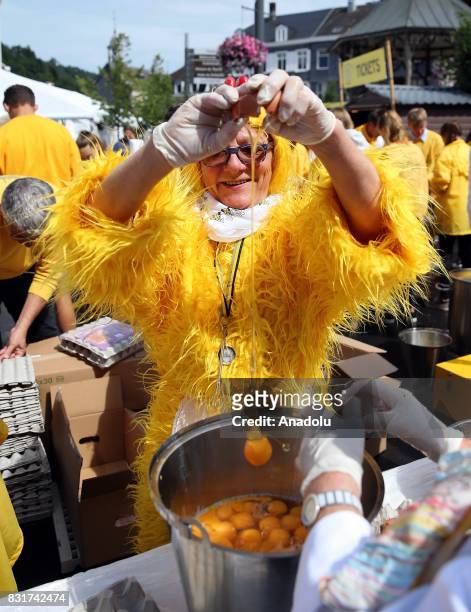 Members of the World Brotherhood of the Huge Omelet cook giant omlette within a 4 metre diameter frying pan in Malmedy, Belgium on August 15, 2017....
