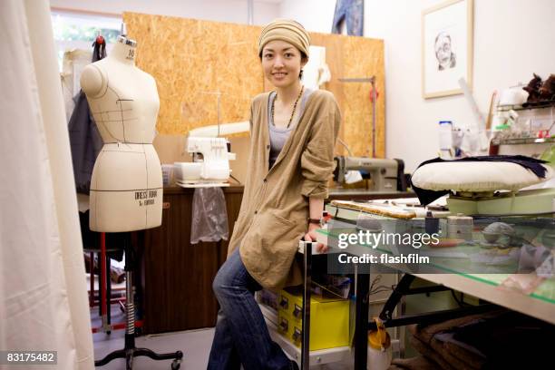 portrait of japanese woman in a studio - designing stockfoto's en -beelden