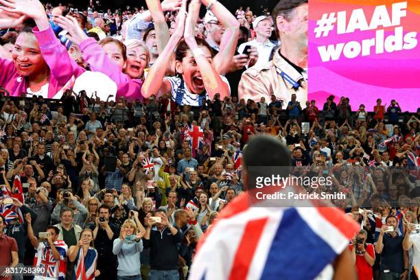 Fans react as Chijindu Ujah, Adam Gemili, Daniel Talbot and Nethaneel Mitchell-Blake of Great Britain celebrate winning gold in the Men's 4x100 Relay...