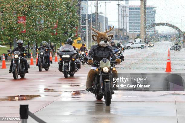 Bango, mascot of the Milwaukee Bucks, rides in with representatives from Harley-Davidson before the announcing and unveiling the team's new uniforms...