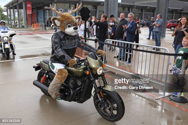 Bango, mascot of the Milwaukee Bucks, rides in with representatives from Harley-Davidson before the announcing and unveiling the team's new uniforms...