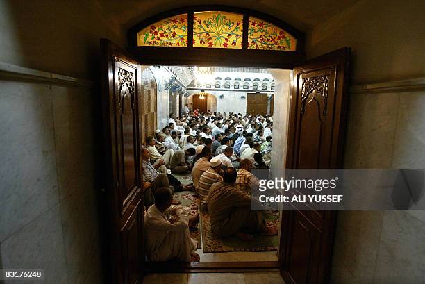 Iraqi Sunni Muslim men perform the Eid Al-Fitr morning prayers at the Sheikh Abdul Qadir al-Jilani mosque in central Baghdad on September 30, 2008....