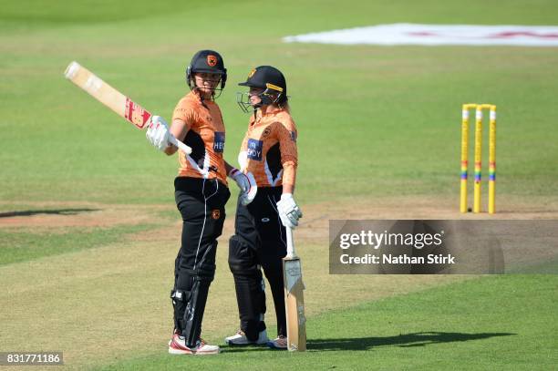 Suzie Bates of Southern Vipers raises her bat after scoring 100 runs during the Kia Super League 2017 match between Loughborough Lightning and...