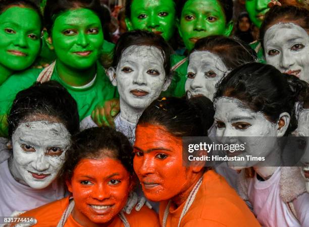 College students take selfie as they get ready for a cultural event in the run up to the Dahi Handi celebrations of 'Janmashtami', which marks the...