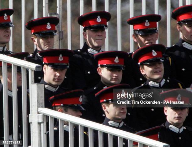 Prince William takes his place in the grandstand seating to watch The Sovereign's Parade at the Royal Military Academy Sandhurst in Surrey which...