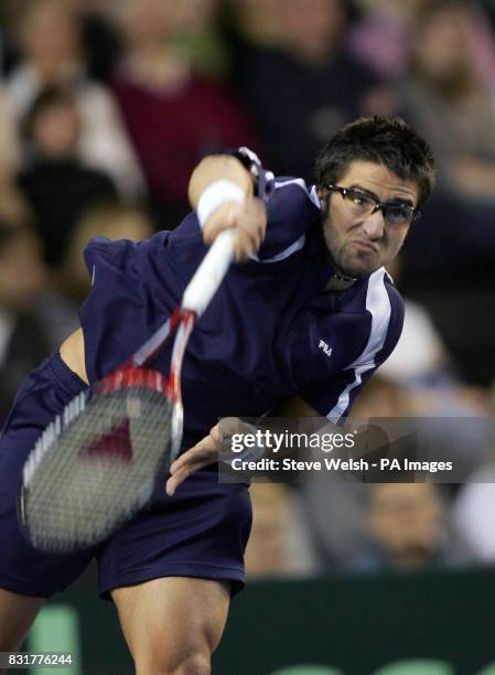 Serbia & Montenegro's Janko Tipsarevic in action with Great Britain's Greg Rusedski during the first day of the Davis Cup at the Braehead Arena,...