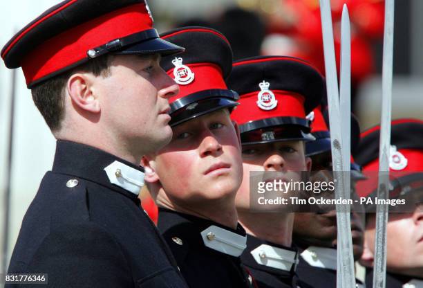 Prince Harry takes his place in The Sovereign's Parade at the Royal Military Academy at Sandhurst in Surrey to mark the completion of his officer...