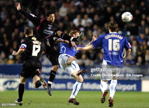 Leicester City's Alan Maybury is challenged by Crystal Palace's Jobi McAnuff during the Coca-Cola Championship match at the Walkers Stadium,...