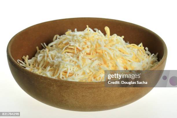 bowl of shredded cheese - shredded stock pictures, royalty-free photos & images
