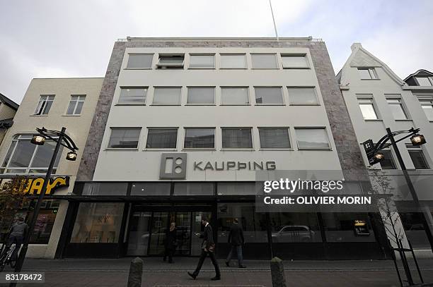 Man walks past a branch of the Icelandic bank Kaupthing on October 8, 2008 in Rejkjavik. The Icelandic state has officially taken control of the...