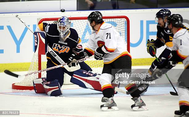 Stefan Liv of Jonkoping get the puck on his head during the IIHF Champions Hockey League match between HV71 Joenkoeping and SC Bern on October 8,...